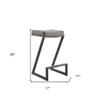 Sgabello da bancone grigio e nero in similpelle senza schienale con altezza seduta di 66 cm